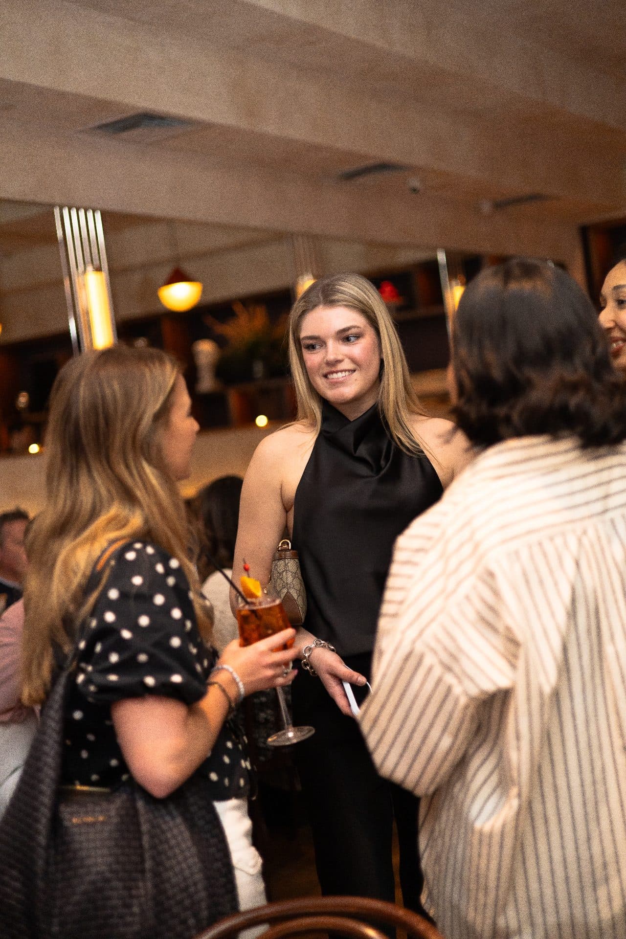Guests socializing at a brand dinner