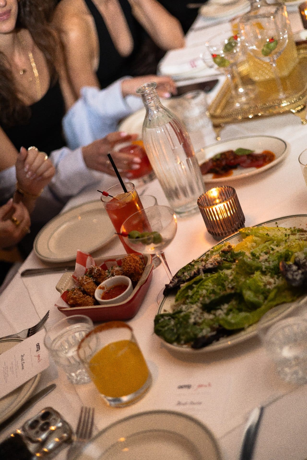 Shared plates and cocktails at a brand dinner